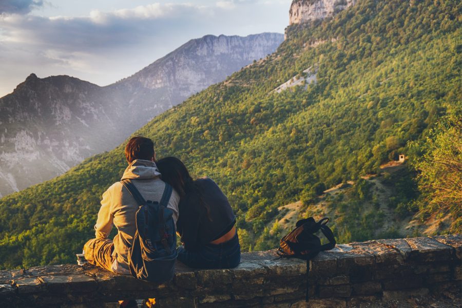 couples sitting in while facing mountain 1483024 couples sitting in while facing mountain 1483024